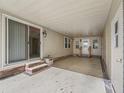 Covered patio with access to sliding glass door at 1303 E Schwartz Blvd, The Villages, FL 32159