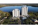 Two elegant high-rise condo buildings overlooking a lake at 13415 Blue Heron Beach Dr # 1501, Orlando, FL 32821