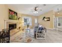 Cozy living room featuring a fireplace and tiled floors at 15831 Se 89Th Ter, Summerfield, FL 34491