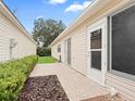 Small backyard with a patio and hedges at 16958 Se 94Th Sunnybrook Cir, The Villages, FL 32162