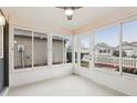 Bright sunroom with sliding glass doors and a ceiling fan at 17461 Se 93Rd Retford Ter, The Villages, FL 32162