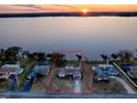 Bird's-eye view showcasing a house's location on a lake at 33648 Picciola Dr, Fruitland Park, FL 34731