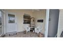 Cozy front porch with comfortable seating and decorative accents at 3621 Amelia Ave, The Villages, FL 32162