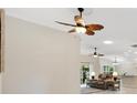 Open living space with recessed lighting and view into the kitchen area at 3962 Neighborly Way, The Villages, FL 32163