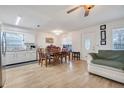 Bright dining area featuring stylish flooring and large windows with ample natural light at 604 Palmetto Dr, Mascotte, FL 34753