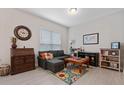 Cozy living room with sectional sofa, game table, and built-in shelving at 729 Calabria Way, Howey In The Hills, FL 34737