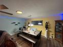 Dining area with light wood table and bench seating at 1017 Willow Dr, Leesburg, FL 34748
