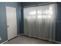 Bright bedroom with light walls and window curtains at 1220 Beulah Rd, Winter Garden, FL 34787