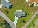 Aerial view of a well-maintained home with a lush green lawn and mature landscaping in a quiet neighborhood at 17664 Se 105Th Terrace, Summerfield, FL 34491