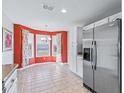 Bright kitchen nook with tiled floor and stainless steel appliances at 2005 Palo Alto Ave, The Villages, FL 32159