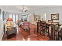 Spacious living room with hardwood floors, and comfortable seating at 2005 Palo Alto Ave, The Villages, FL 32159