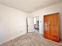 Unfinished bedroom with wood flooring and a closet at 248 E Magnolia St, Groveland, FL 34736