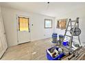 Unfinished spare bedroom with new door and window at 248 E Magnolia St, Groveland, FL 34736