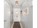 Interior entryway with gray walls and white door at 2555 Sw 154Th Place Rd, Ocala, FL 34473