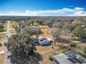 Aerial view of house and surrounding neighborhood at 32531 Wolfs Trl, Sorrento, FL 32776