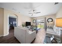 Living room with two sofas, coffee table, and view into adjacent bedroom at 5756 Lakeside Landings Blvd, Winter Haven, FL 33881