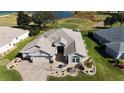 Home situated on a golf course, near a lake at 9059 Se 177Th Grassmere St, The Villages, FL 32162