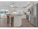 Modern kitchen with granite countertops and a spacious island at 10406 Lakeshore Dr, Clermont, FL 34711