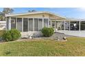 Charming single-story home with a covered carport and a well-maintained front yard at 11 Orangewood Dr, Fruitland Park, FL 34731