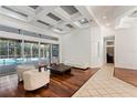 Spacious living room with hardwood floors, high ceilings, and access to pool at 1286 Prince Ct, Lake Mary, FL 32746
