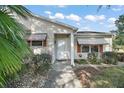 House entrance with walkway and nicely landscaped area at 2001 Cristo Rd, Lady Lake, FL 32159