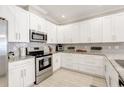 Modern kitchen with stainless steel appliances and granite countertops at 2029 Sloans Outlook Dr, Groveland, FL 34736