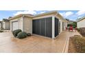 Enclosed patio with seating area, perfect for relaxing at 3764 Ivey Ter, The Villages, FL 32163