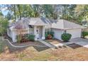 Single story house, gray exterior, and a landscaped yard at 6820 Cherry Pass, Ocala, FL 34472