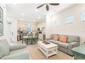Open concept living and dining area with an adjacent kitchen at 8059 Knee Deep Rd, Kissimmee, FL 34747