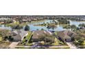 Aerial view of the property showing its location within a community near a scenic lake at 8920 Bridgeport Bay Cir, Mount Dora, FL 32757