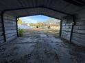 View from inside an empty garage at 1109 Pioneer Trl, Leesburg, FL 34748