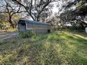 Small outbuilding in the backyard at 1109 Pioneer Trl, Leesburg, FL 34748