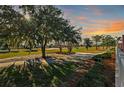 Stunning view of a tree-lined golf course from a property's backyard at 1504 Aalto Pl, The Villages, FL 32159