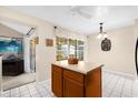 Eat-in kitchen with island and view of Gathering room at 2043 Sawgrass Dr, Apopka, FL 32712