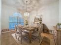 Formal dining room with wood table and neutral decor at 2289 Twickingham Ct, Clermont, FL 34711