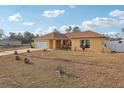 Charming single-Gathering home featuring a well-maintained lawn and a two-car garage with a beautiful landscape at 2385 Sw 159Th Ln, Ocala, FL 34473