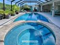 Inviting pool and spa area, perfect for relaxation at 3735 Conservation Trl, The Villages, FL 32163