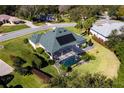 House with pool and solar panels, aerial view at 39248 Tacoma Dr, Lady Lake, FL 32159