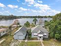 Aerial view of house, garage and lakefront lot at 39645 Turek Ln, Umatilla, FL 32784