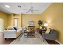 Spacious living room with hardwood floors, neutral color palette and ample natural light at 526 Kingston Way, The Villages, FL 32162