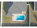 Rectangular pool with tan pavers and white fence at 10300 Se 69Th Ter, Belleview, FL 34420