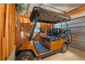 Garage with a golf cart at 1307 Lopez Ln, The Villages, FL 32159