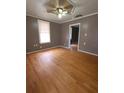 Spacious living room with hardwood floors and neutral walls at 1420 Old Mount Dora Rd, Eustis, FL 32726