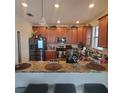 Spacious kitchen featuring granite countertops and modern appliances at 2287 Victoria Dr, Davenport, FL 33837