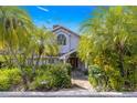 Two story house exterior with lush landscaping and stone pathway at 2450 Topping Pl, Eustis, FL 32726