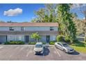 Two-story building with parking lot and lush greenery at 40 Moree Loop # 1, Winter Springs, FL 32708