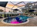 The pool is surrounded by landscaping with plenty of space for dining and relaxing in the Florida sun at 4515 Biggs Pl, The Villages, FL 32163