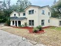 Two-story house with landscaping and a large yard at 4520 N Hiawassee Rd, Orlando, FL 32818