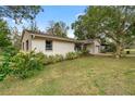 Side view of the house showcasing the exterior siding and landscaping at 5301 Se 115Th Pl, Belleview, FL 34420