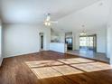 Bright living room with hardwood floors and high ceilings at 733 Cherry Laurel St, Minneola, FL 34715